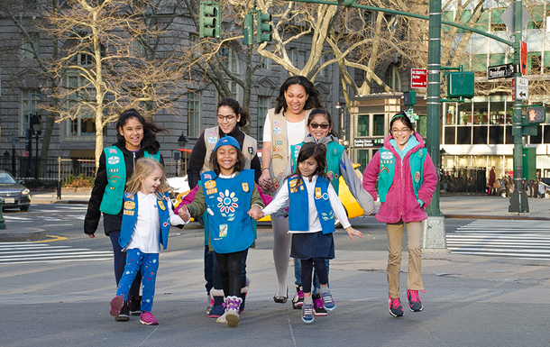 A group of girl scouts in uniform in NYC streets